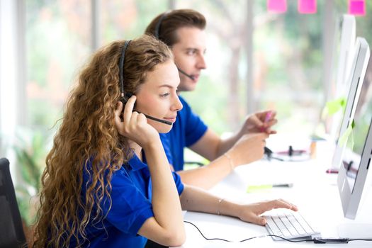 Call center operators.Call center operator in headset while consulting client. Telemarketing or phone sales. Customer service and business concept.