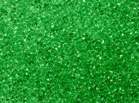 Background pattern of green rhinestone crystals