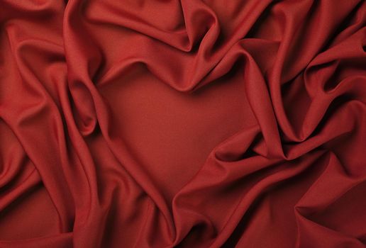 Red heart shape textile fold pleats background