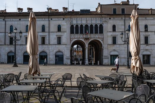 An almost empty Loggia Square in Brescia (Lombardy, Italy).