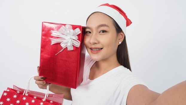 Girl hold gift box make selfie or video online with x-mas christmas prop accessories