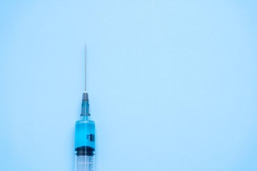 Syringe with coronavirus vaccine and a chip inside the vaccine. Conspiracy theory. Chipping people