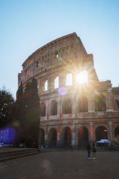 View of Colosseum in Rome and morning sun, Italy, Europe