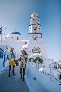Pyrgos, Santorini, Greece. Famous attraction of white village with cobbled streets, Greek Cyclades Islands, Aegean Sea couple on vacation Santorini Greece