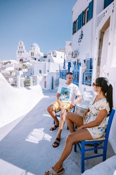 Pyrgos, Santorini, Greece. Famous attraction of white village with cobbled streets, Greek Cyclades Islands, Aegean Sea couple on vacation Santorini Greece
