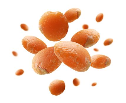 Red lentils levitate on a white background