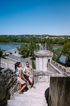 couple city trip Avignon Southern France, Ancient Popes Palace, Saint-Benezet, Avignon, Provence, France