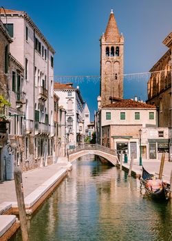 Beautiful venetian street in summer day, Italy Venice