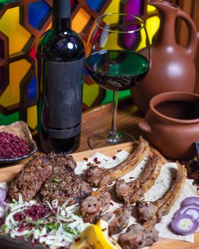 Lyulya kebab, sheep meat meal with wine bottle and glass
