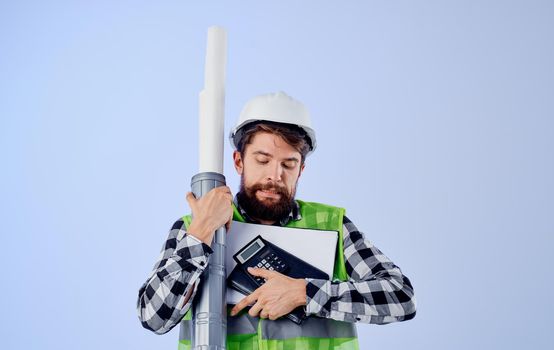 engineer with blueprints in hands construction industry profession blue background