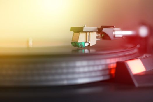 Playing retro music: Professional turn able audio vinyl record music player. Sunbeam.