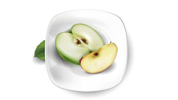 Green and red apple slices on a white plate.