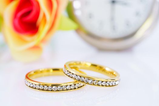 Close up two golden wedding rings  on white background