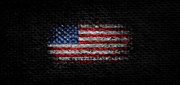 National flag of the United States on dark fabric