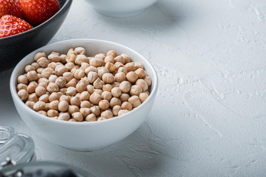 Chickpea in bowl with space for text, on white background