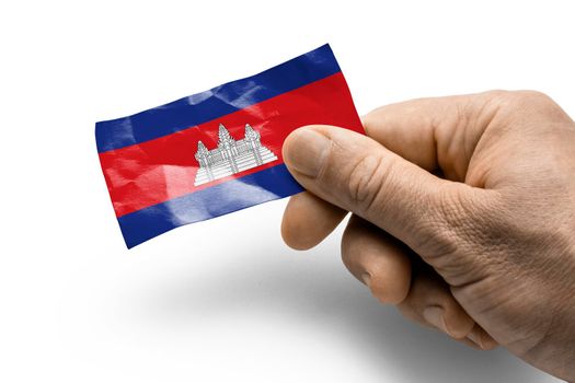 Hand holding a card with a national flag the Cambodia