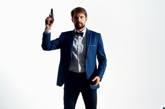 man in suit holding pistol danger gangster murder isolated background