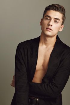 handsome man fashion hairstyle glamor black shirt studio self-confidence model