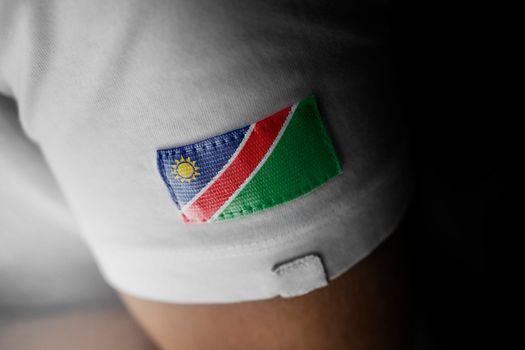 Patch of the national flag of the Namibia on a white t-shirt