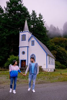 Vancouver Island, Canada, Quadra Island old historical church by the harbor at Cape Mudge , couple on vacation at Vancouver Island