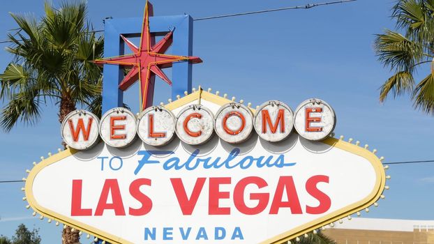 Welcome to fabulous Las Vegas retro neon sign in gambling tourist resort, USA. Iconic vintage banner as symbol of casino, games of chance, money playing and hazard betting. Lettering on signboard