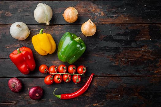 Mix sweet bell pepper and onions, on old dark wooden table background, top view flat lay with copy space for text