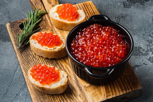 Canape with Red Salmon Caviar for New Year, on gray background