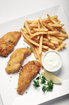 british traditional fish and chips meal on plate
