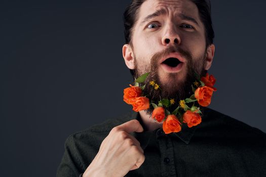 portrait man flowers in a beard romance gift emotions close-up. High quality photo