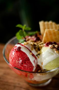 strawberry and pistachio gelato ice cream sundae dessert in bowl