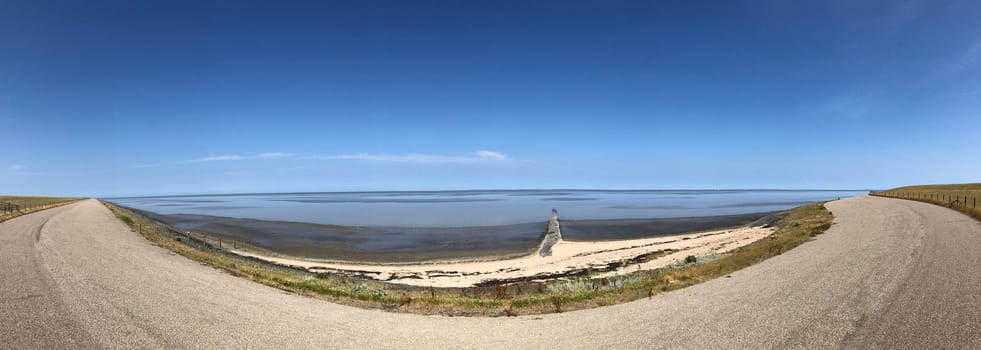 Panorama from a dike in Friesland next to the wadden sea