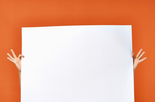 white sheet of paper ad advertisement man in the background orange background mockup poster