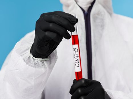 Laboratory black gloves blood test biochemistry research close-up covid-19