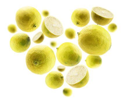 Yellow limes in the shape of a heart on a white background