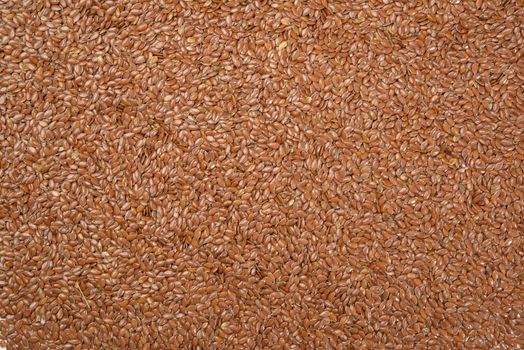 texture of dry brown flax seeds, top view