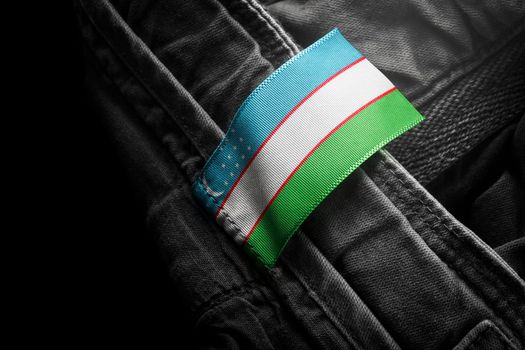Tag on dark clothing in the form of the flag of the Uzbekistan
