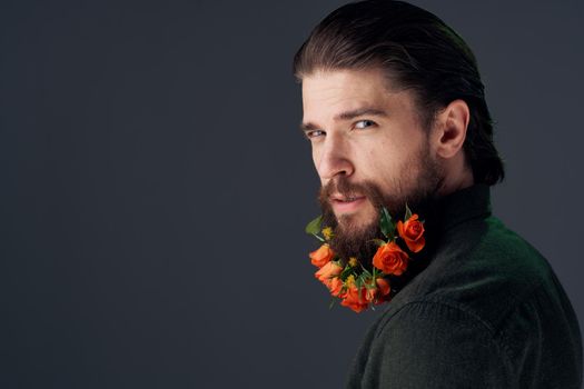Cute man flowers in beard ornaments elegant style close-up