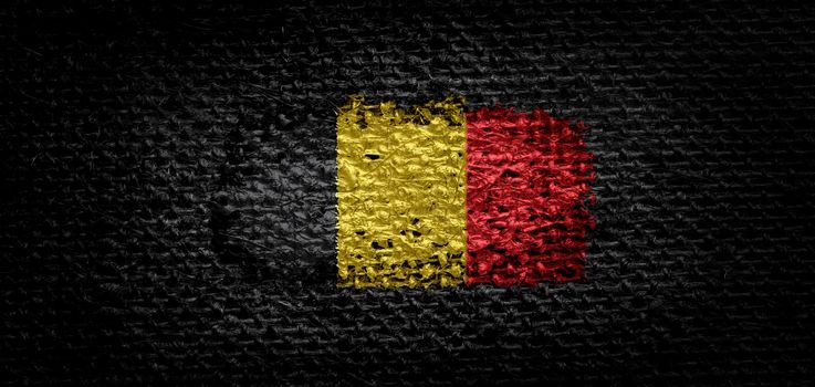 National flag of the Belgium on dark fabric