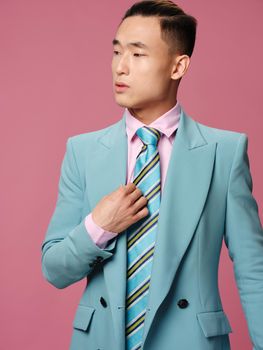 Business man in suit self confidence pink background model