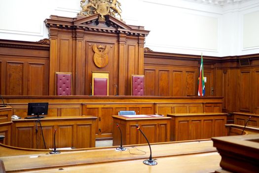 Empty courtroom, with old wooden paneling