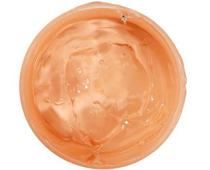 orange moisturizing translucent cream in a plastic jar