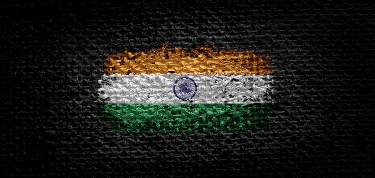 National flag of the India on dark fabric