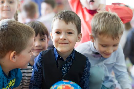 Belarus, the city of Gomil, April 25, 2019.Open day in kindergarten. Portrait of a child with a ball. Six year old boy