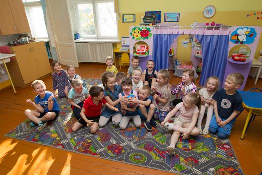 Belarus, the city of Gomil, April 25, 2019.Open day in kindergarten. Many children in kindergarten. A group of six year old boys and girls.