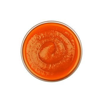 Glass bowl of orange chili sauce isolated on white
