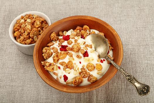 Portion of muesli granola breakfast with yogurt