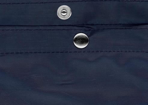 snap fastener on blue fabric