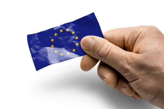 Hand holding a card with a national flag the European Union