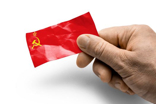 Hand holding a card with a national flag the USSR
