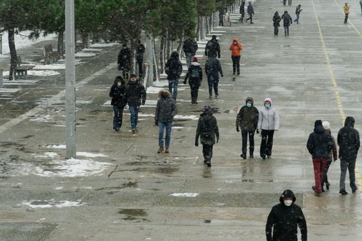 Thessaloniki, Greece Medea front hits with heavy snowfall the city center, with crowd moving.